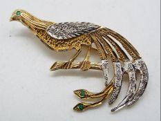 A 9ct gold stone set brooch in the form of a peacock, approximately 4.2 grams all in.