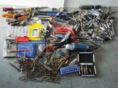 Tools - Angle grinder, Sockets, Screwdrivers, Drill bits, Blades and various related tools.
