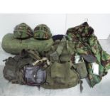 Military Equipment - Lot to include two combat helmets, GS mk6, decontamination kits, canvas bags,