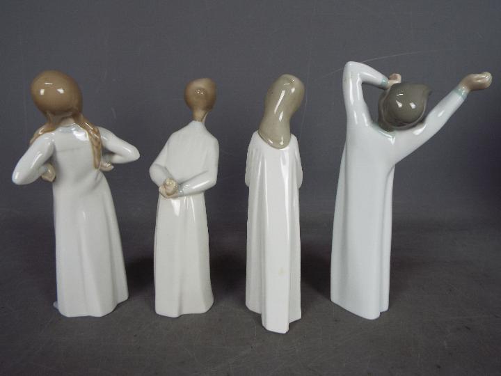 Lladro - Four Lladro figurines, one boxed, to include 'Boy Awaking', 'Girl With Candle' and similar, - Image 3 of 4