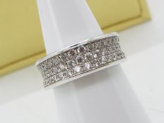 An 18ct white gold and diamond ring by David M Robinson, pave set with 47 stones in three rows,