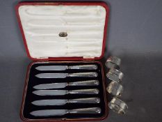 A cased set of six George V hallmarked silver handled knives,