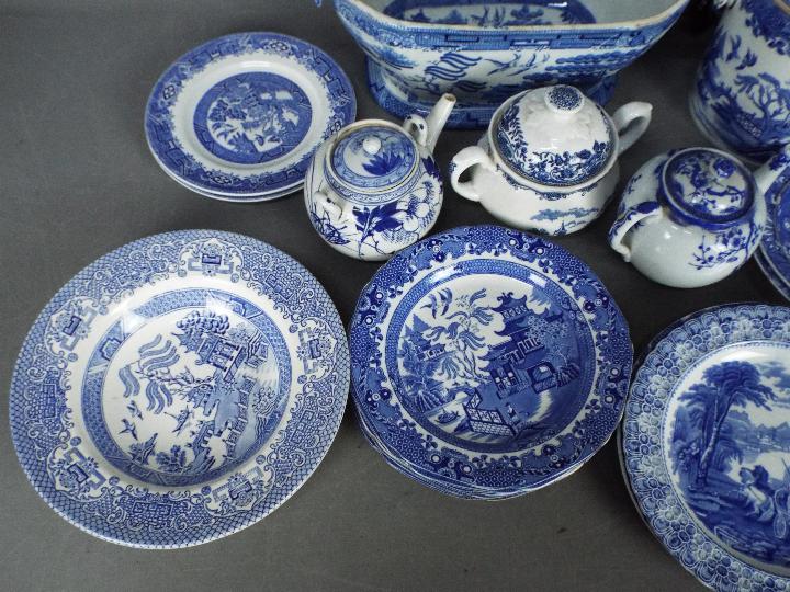 A collection of blue and white ceramics to include Oriental, English Ironstone, Willow and similar. - Image 2 of 8