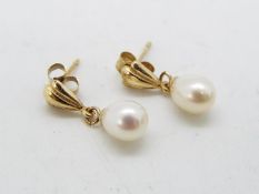 A pair of pearl drop earrings, butterflies stamped 9ct, approximately 1 gram all in.
