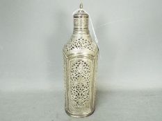 An Iranian / Persian silver bottle cover with pierced and chased decoration,