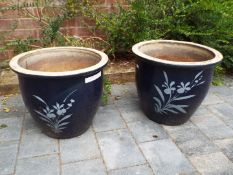 A pair of stoneware garden planters, Oxford blue with floral decoration,