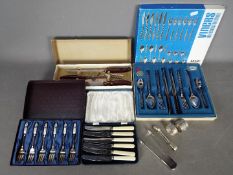 A boxed 24 piece set of Viners 'Mosaic' pattern cutlery,