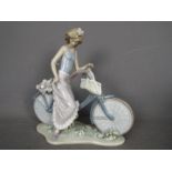 Lladro - A large Lladro figurine entitled Biking In The Country, # 5272,