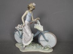 Lladro - A large Lladro figurine entitled Biking In The Country, # 5272,