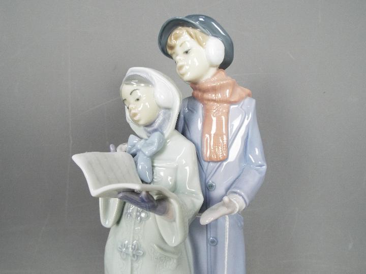 Lladro - A boxed Lladro figurine # 6218 Christmas Melodies depicting two carol singers, - Image 3 of 4