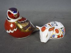 Royal Crown Derby - Two paperweights comprising Chaffinch and Sleeping Piglet,