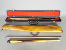 Two pool cues comprising a BCE two piece example and similar,