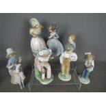 Nao - Seven figurines by Nao, predominantly of children, largest approximately 21 cm (h).