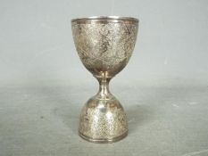 An Iranian / Persian silver twin end spirit measure or egg cup, approximately 98 grams all in.