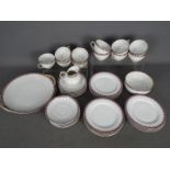 A Limoges Frank Haviland tea set, comprising of trios, milk jug, sugar bowl and serving plates,