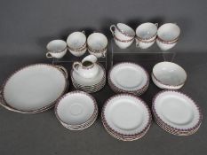 A Limoges Frank Haviland tea set, comprising of trios, milk jug, sugar bowl and serving plates,