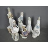 Seven Spanish porcelain figurines to include Lladro, Nao and similar,