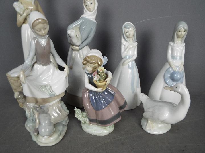 Seven Spanish porcelain figurines to include Lladro, Nao and similar, - Image 2 of 3