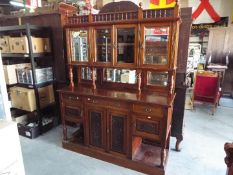 A late 19th / early 20th century large carved mahogany buffet sideboard,