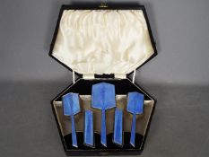 A cased five piece silver and guilloche enamel dressing table set comprising hand mirror,