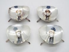 A set of four 1950s white metal Cohr Atla candlesticks or holders stamped Denmark,