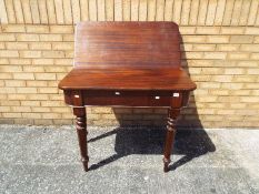 A late Georgian / early Victorian D-end flip top mahogany dining table on tapering turned supports,