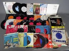 A collection of 7" vinyl records to include David Bowie, The Kinks, The Who,