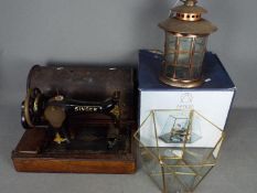 Lot to include a vintage Singer sewing machine, boxed serving cloche and a candle lantern.
