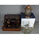 Lot to include a vintage Singer sewing machine, boxed serving cloche and a candle lantern.