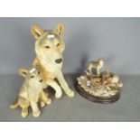 Country Artists - A large figural group depicting a wolf and cub entitled Safe Haven,