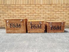 Fortnum & Masons - three large wicker baskets, marked Fortnum & Masons,