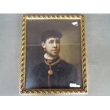 A small oil on board portrait depicting a lady in period dress, framed under glass,