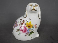 Royal Crown Derby - a ceramic paperweight entitled The Spaniel with gold stopper,