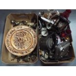 Two boxes containing a large collection of plated ware, brass ware,