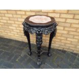 A late 19th century Chinese red marble topped,