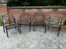 Four metal garden armchairs,