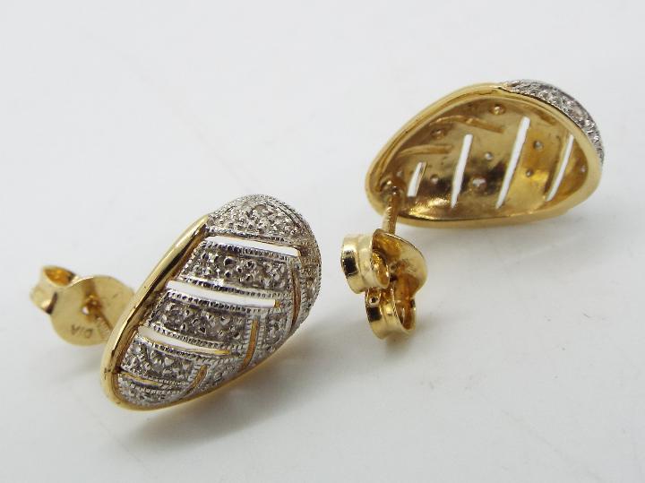 A pair of 14ct and diamond earrings, approximately 2.7 grams all in. - Image 2 of 2