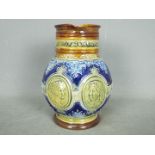 A Doulton Lambeth glazed stoneware jug commemorating the Diamond Jubilee of Queen Victoria with