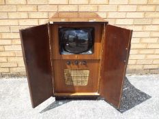A vintage EKCO television cabinet measuring approximately 84 cm x 53 cm x 45 cm.