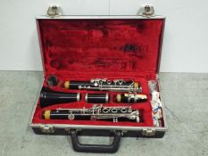 Clarinet in lined fitted box. Case is 36 cm wide.