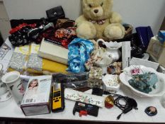 Lot to include five packs of bed sheets and duvet covers, head scarves, handbags, bear, ceramics,