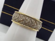 A 14ct gold and diamond set ring, size M, approximately 3.4 grams all in.