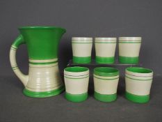 Royal Doulton - an Art Deco 7-piece lemonade set comprising bright green and white striped eggshell