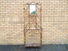 A late 19th century bamboo hall stand with tortoiseshell finish and oblong metal drip tray,