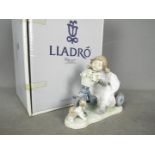 Lladro - A boxed Lladro figurine # 5679 In No Hurry, depicting a young girl on a tricycle,
