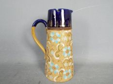 Doulton - a ceramic and pewter jug,