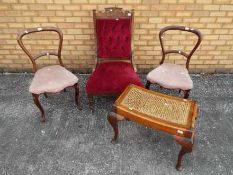 Three chairs and a stool with cane seat.