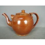 An Edwardian oversized salt glazed teapot,
