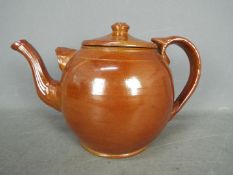 An Edwardian oversized salt glazed teapot,