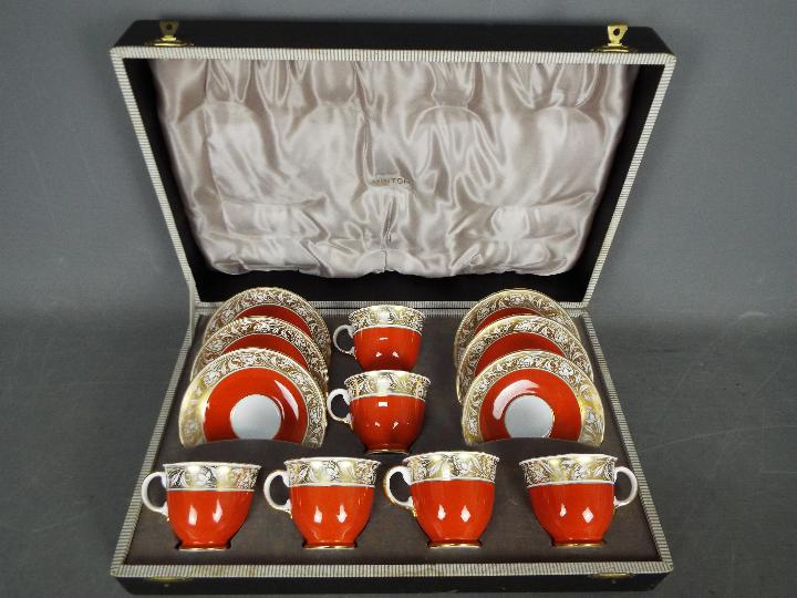 An early 20th century cased Minton porcelain set of 6 cups and saucers,